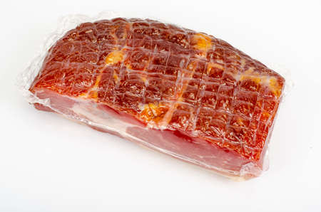 Piece of raw smoked pork ham on white background. photo