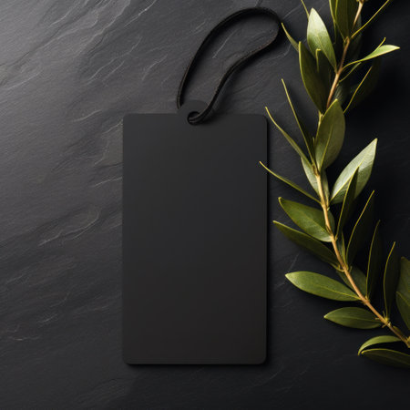 black blank tag with blank front realistic on a mockup template in a black stone tableの素材