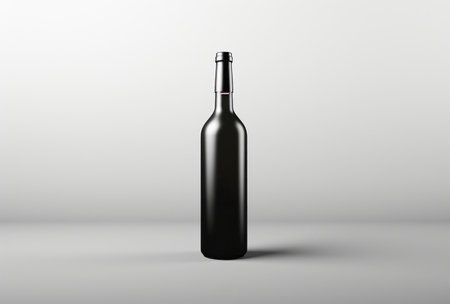 a bottle of red wine against a white background.の素材