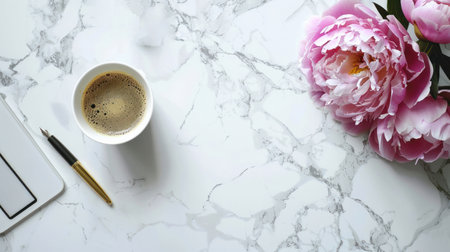 A cup of coffee, a telephone, a ballpoint pen, and a Peony flower lie on a white marble table.の素材