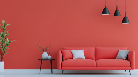A vibrant living room showcases a coral wall with a minimalist round art piece. A stylish sofa with cushions and a small table with a plant completes the inviting atmosphere.の素材