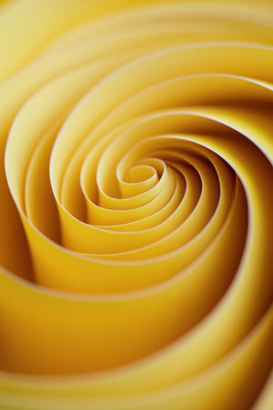 A vibrant, swirling pattern in shades of yellow elegantly draws the eye into its spiral formation, evoking a sense of motion and warmth. The smooth curves create a striking visual experience.の素材