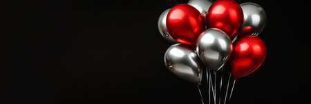 A cluster of shiny red and silver balloons fills the frame, creating a joyful and festive atmosphere. These colorful decorations are perfect for parties, gatherings, or special occasions.の素材