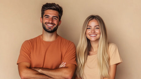 Two individuals stand side by side with cheerful expressions, showing a friendly and relaxed atmosphere. They are dressed casually and appear to enjoy each others company.の素材