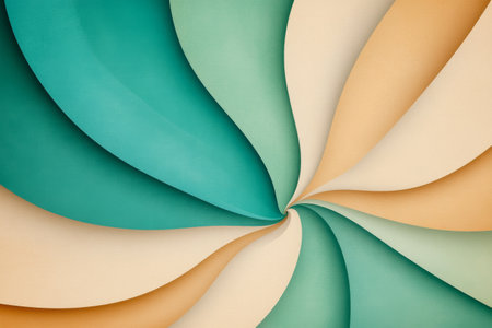 Swirling layers of different colored paper create an abstract design featuring teal, cream, and light orange tones. The smooth curves form a dynamic, artistic visual effect.の素材