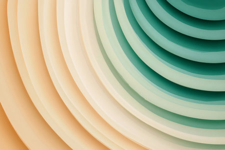 Swirling layers of different colored paper create an abstract design featuring teal, cream, and light orange tones. The smooth curves form a dynamic, artistic visual effect.の素材