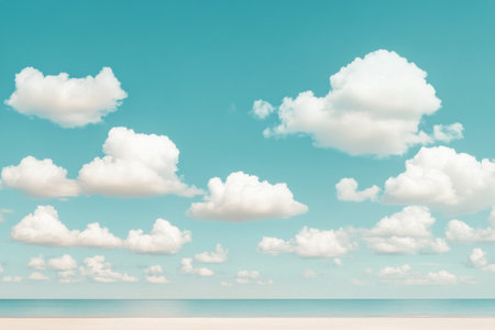 A serene beach stretches along the coastline, reflecting the sky and nearby cliffs. Fluffy clouds hover overhead, creating a peaceful atmosphere. Visitors can enjoy sunbathing and relaxing.の素材