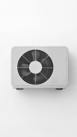 A sleek wall-mounted air conditioning unit is installed on a white wall, providing efficient cooling for a room..の素材