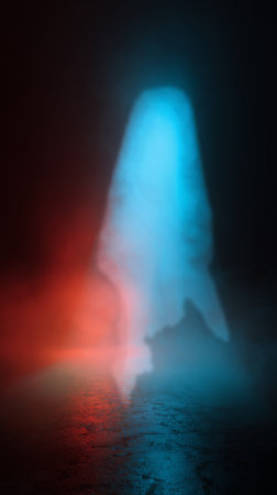 A strong light beam pierces through thick fog, creating a striking visual with blue and red hues. The scene is dark and atmospheric, evoking a sense of mystery and drama..の素材