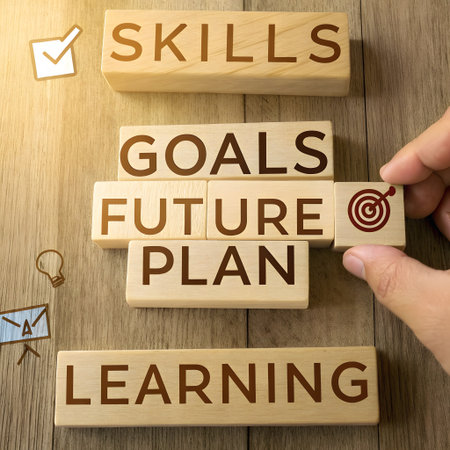 Businessman's hand placing a wooden block with the words Goals, Fulfillment and LEARNING.の素材