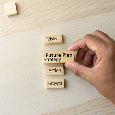 Business concept image, Close up of businessman hand placing wooden block with FUTURISTIC STRATEGY PLAN text on wood block.の素材