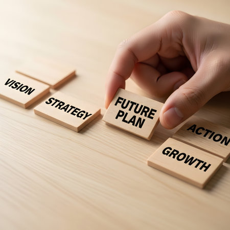 Business and finance concept, Close up of human hand putting wooden cube block with word FUTURISTIC PLANの素材