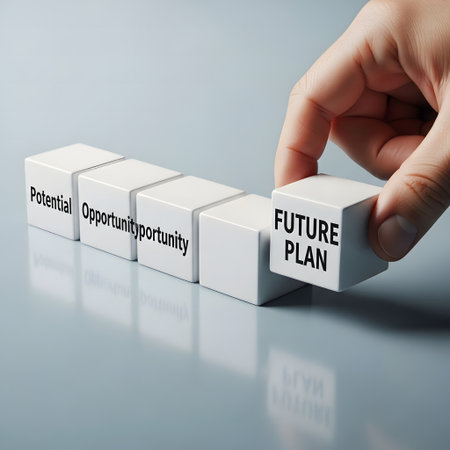 Businessman turns cubes and changes the word budget to budget planning.の素材