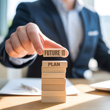Juridical concept. Businessman building a tower with wooden blocks.の素材
