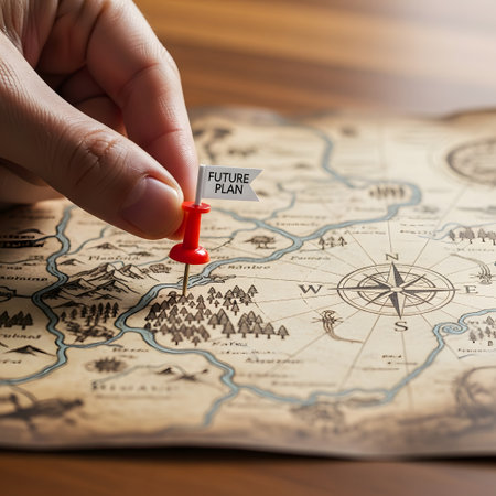 Travel destination concept. Woman hand with red pin on old map.の素材