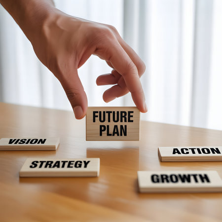 Future plan concept. Businessman's hand placing a block with the word future plan.の素材