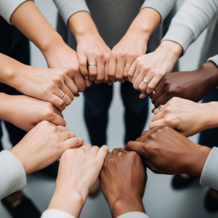 cropped shot of multicultural businesspeople forming circle with hands isolated on greyの素材