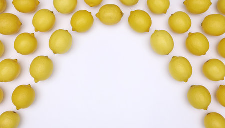Composition with ripe lemons flat lay on white background showcasing fresh citrus fruit, perfect for food photography, healthy lifestyle branding, recipe design, and natural product marketing.の素材