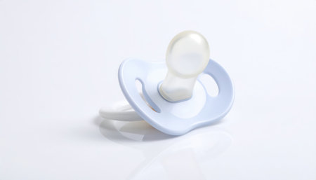 Close up of a baby pacifier with copy space background, suitable for parenting themes, childcare concepts, newborn essentials, family lifestyle design, and infant product presentations.の素材