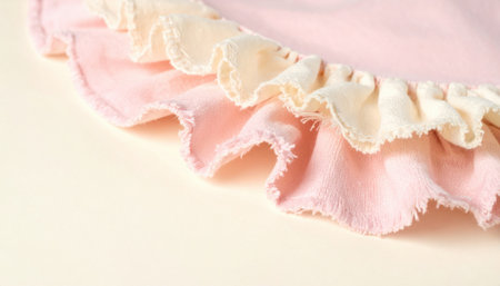 rag doll collar ruffle macro on cream board soft studio closeup stitch texture delicate trim clean textile craft detail for handmade toy stylingの素材