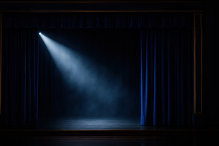 Royal blue silk curtains opening onto subtle atmospheric haze with a crisp white spotlight cone brushed brass proscenium and refined mid key contrastの素材