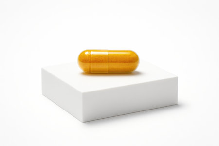 Dried turmeric powder capsule unbranded centered minimal product studio isolated on pure whiteの素材