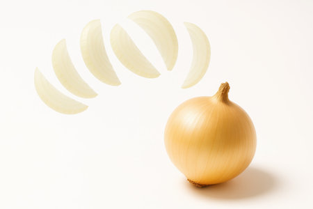Vidalia onion whole bulb with slices captured mid air forming gentle arc on white background for fresh vegetable cooking and motion food themesの素材