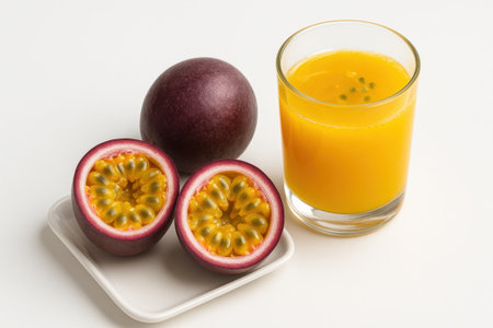 Passion fruit maracuya with whole fruit half and glass of juice on clean white background tropical drink concept for healthy diet breakfast menu cafe branding and packagingの素材