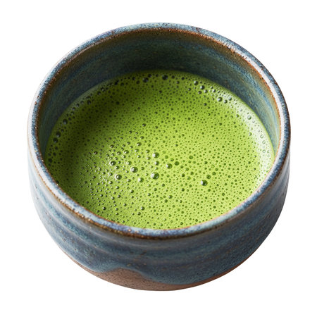 Matcha green tea in ceramic cup. Isolated over white backgroundの素材