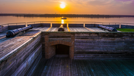 Golden Hour at a Historic Riverside Fort with Cannonsの素材