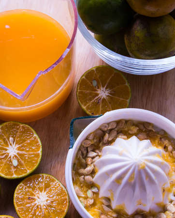 The orange  juicing.