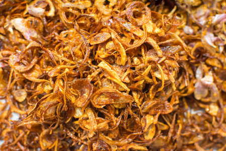 Cooking components of Thai food. Chili, garlic, onion, kaffir lime leaves, pork crackling, fried.の写真素材