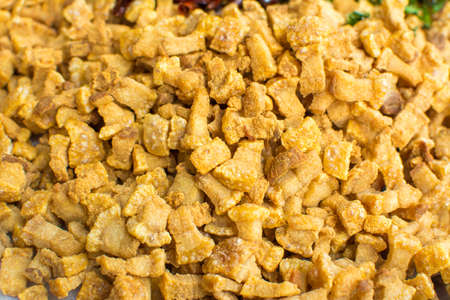 Cooking components of Thai food. Chili, garlic, onion, kaffir lime leaves, pork crackling, fried.の写真素材