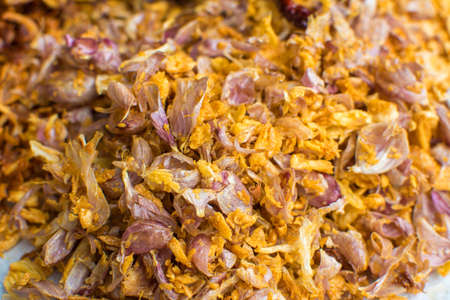 Cooking components of Thai food. Chili, garlic, onion, kaffir lime leaves, pork crackling, fried.の写真素材