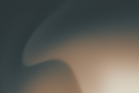 White green blurred gradient on dark grainy background, glowing light spotの写真素材