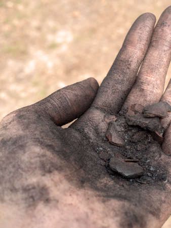 hand with fragments of earthの写真素材