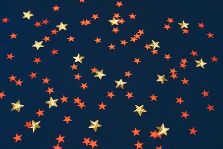 Dark blue background with yellow and red stars. Festive abstract concept. Background, great design...