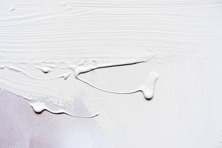 White sheet of plywood with white paint stains. Life with a clean slate.
