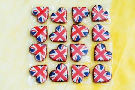 Several heart shaped gingerbread cookies with the image of the flag of Great Britain. Valentines day concept.の写真素材