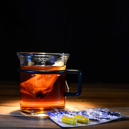 tea with vitamin pillsの写真素材
