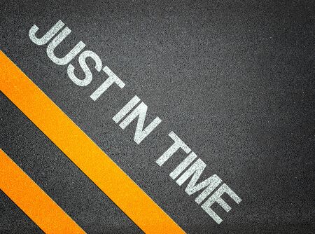 Just in time Text Writing Road Asphalt Word Floor Groundの写真素材