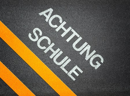 Achtung Schule - Attention School German - Text Road Asphaltの写真素材