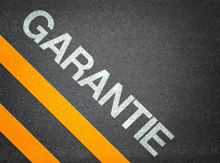 German Garantie Warranty Text Writing Road Asphalt Word Floor Groundの写真素材