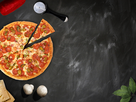 fresh pizza with mushrooms salami pepper on dark beackgroundの写真素材