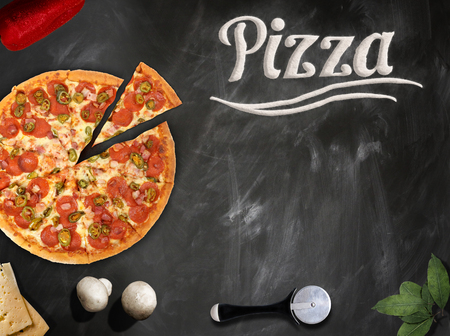 fresh pizza with mushrooms salami pepper on dark beackgroundの写真素材