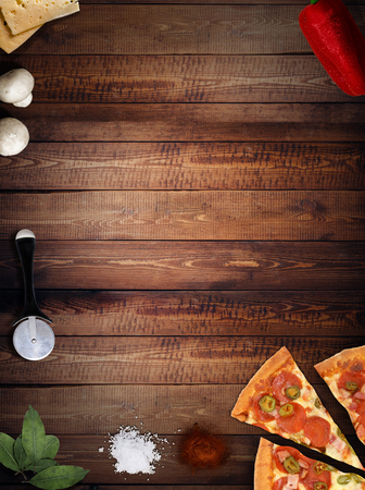 fresh pizza with mushrooms salami pepper on dark beackgroundの写真素材