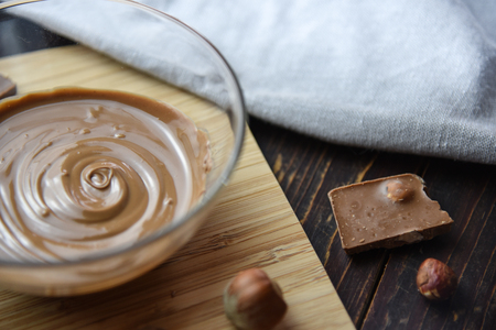 Cracked chocolate pile on dark background with shallow depth of fieldの写真素材