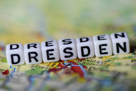 Word DRESDEN formed by alphabet blocks on atlas mapの写真素材