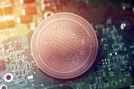 shiny copper SUBSTRATUM cryptocurrency coin on blurry motherboard backgroundの写真素材