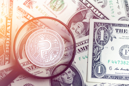 shiny golden PIVX cryptocurrency coin on blurry background with dollar money 3d illustrationの写真素材